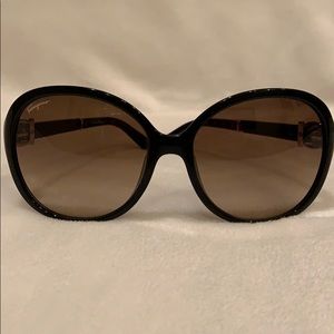 Salvatore Ferragamo sunglasses good small scratch.